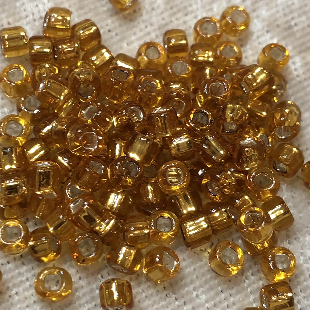 6/0 Silver Lined Transparent Amber 4 Japanese Seed Beads