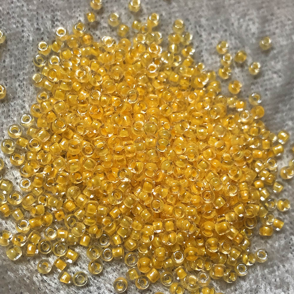 11/0 Tangerine Lined Crystal 202A Japanese Seed Beads