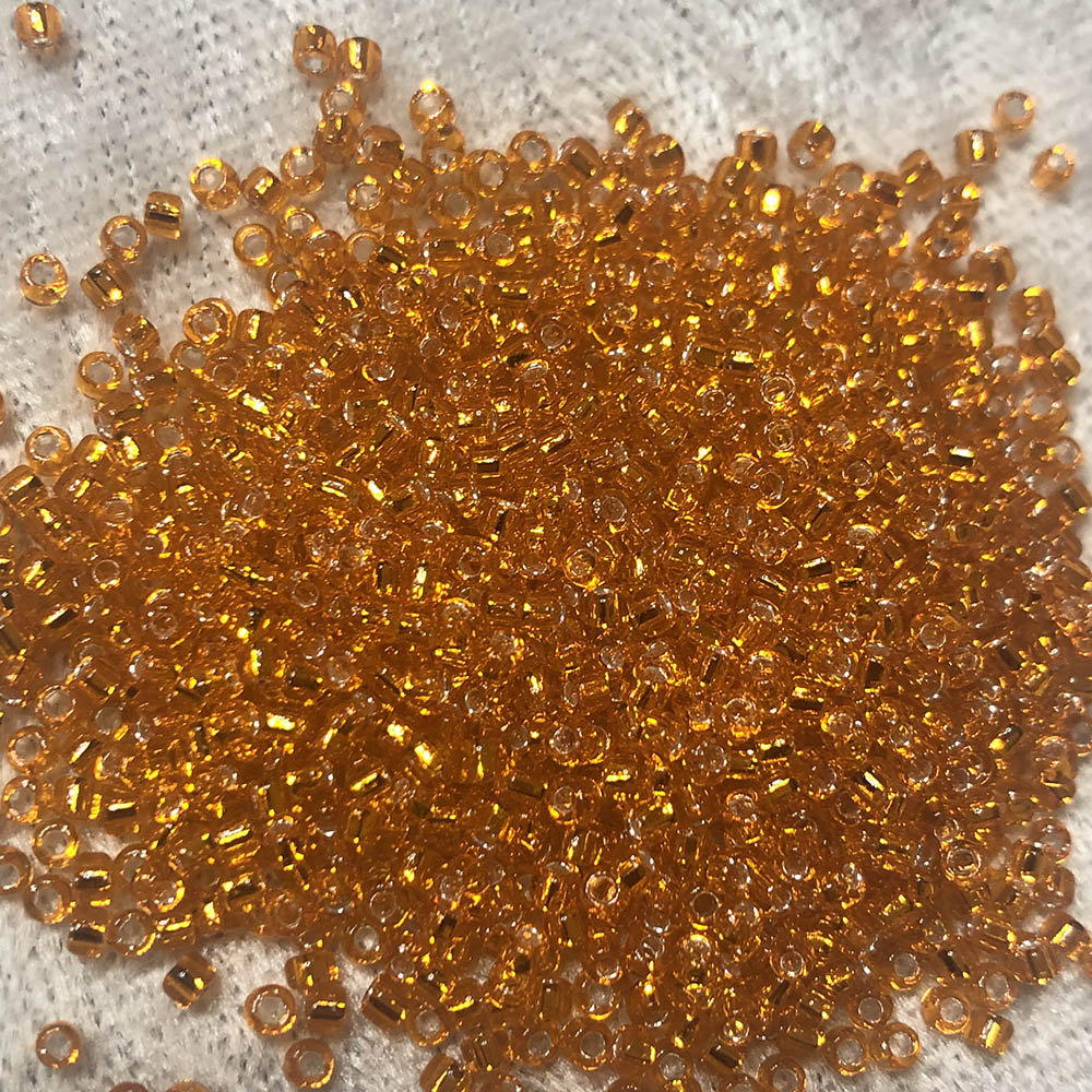 11/0 Transparent Orange Silverlined 9 Japanese Seed Beads