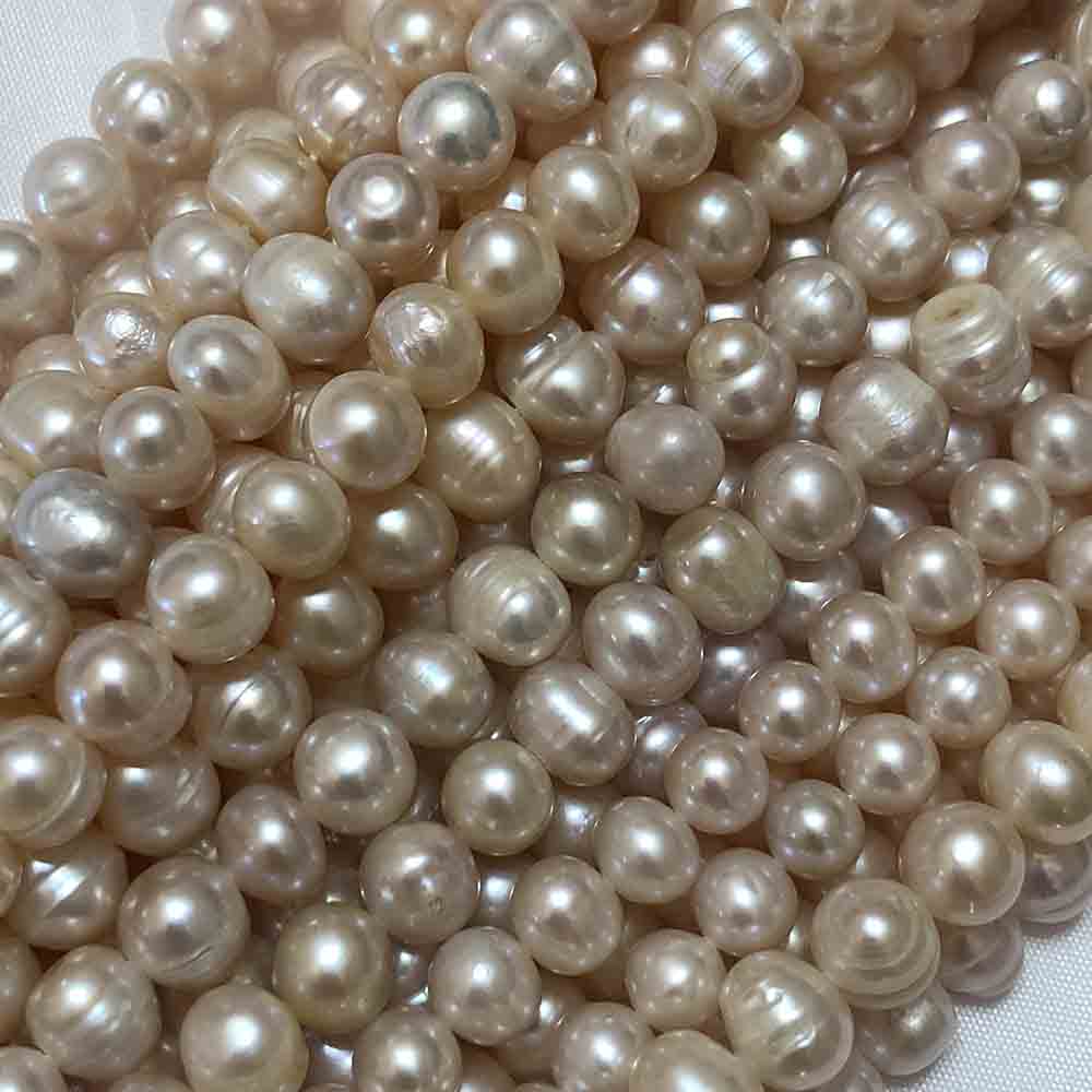 Medium Large Pink Cream Semi-Smooth Roundish Cultured Pearls