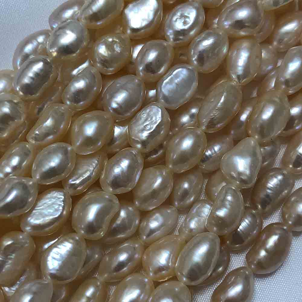 Medium Large Pink Cream Semi-Smooth Oval Cultured Pearls