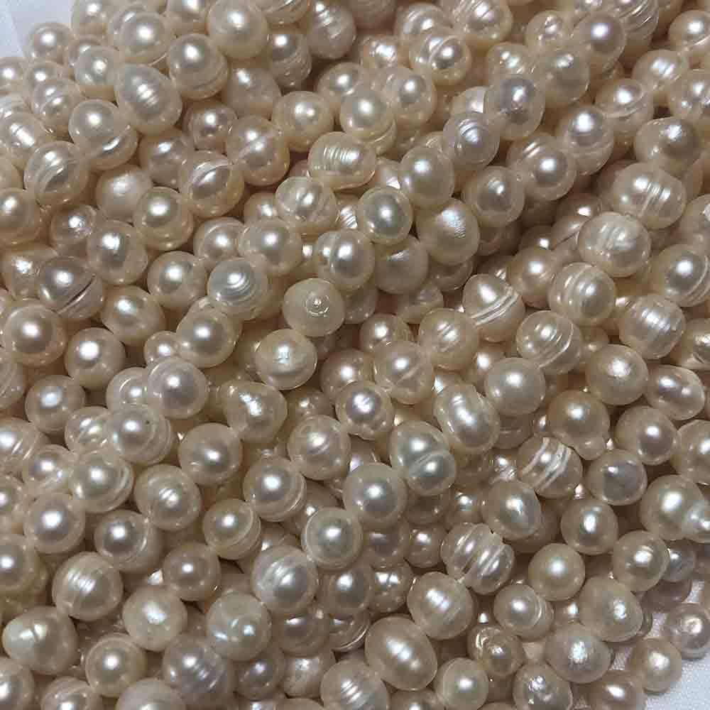 Medium Peach Cream Semi-Smooth Round Cultured Pearls