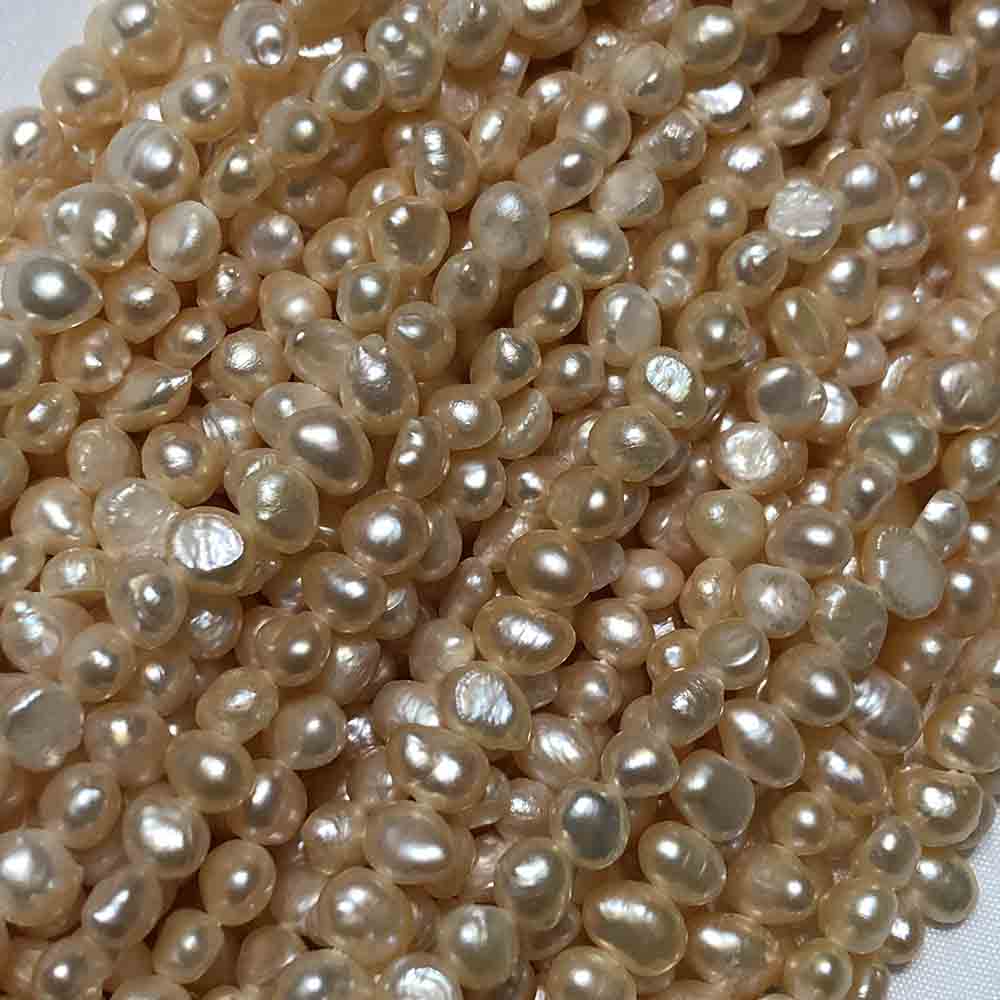 Light Peach Semi-Smooth Oblong Disc Shaped Cultured Pearls