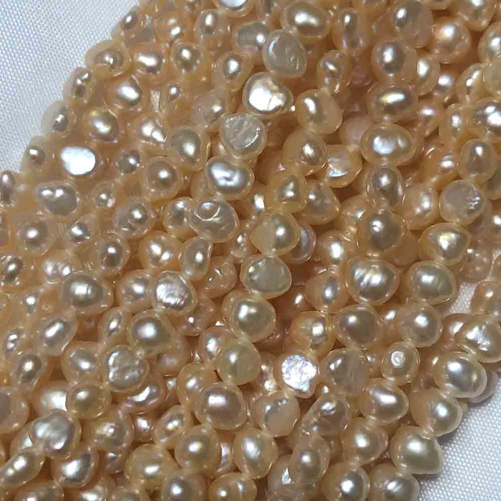 Small Peach Cream Irregular Disc Shape Cultured Pearls