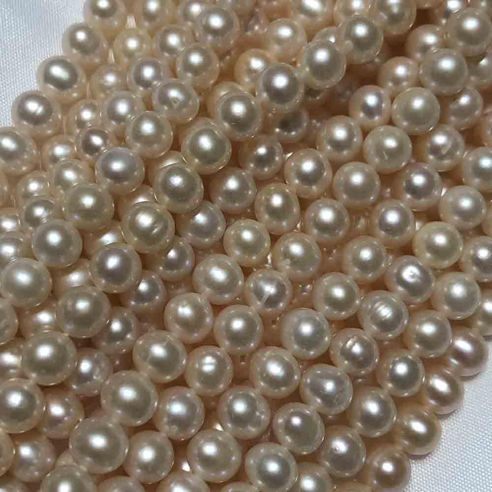 Medium Small Cream Round Cultured Pearls