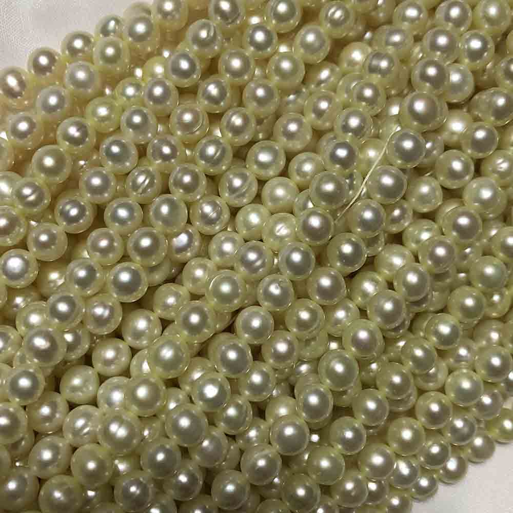 Medium Small Light Yellow Round Cultured Pearls