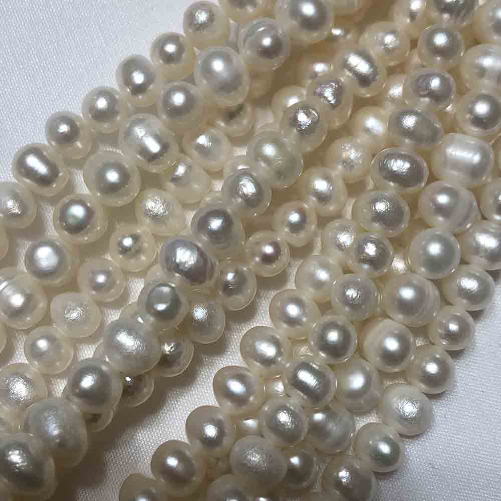 Small Medium White Iris Irregular Round-Oblong Cultured Pearls