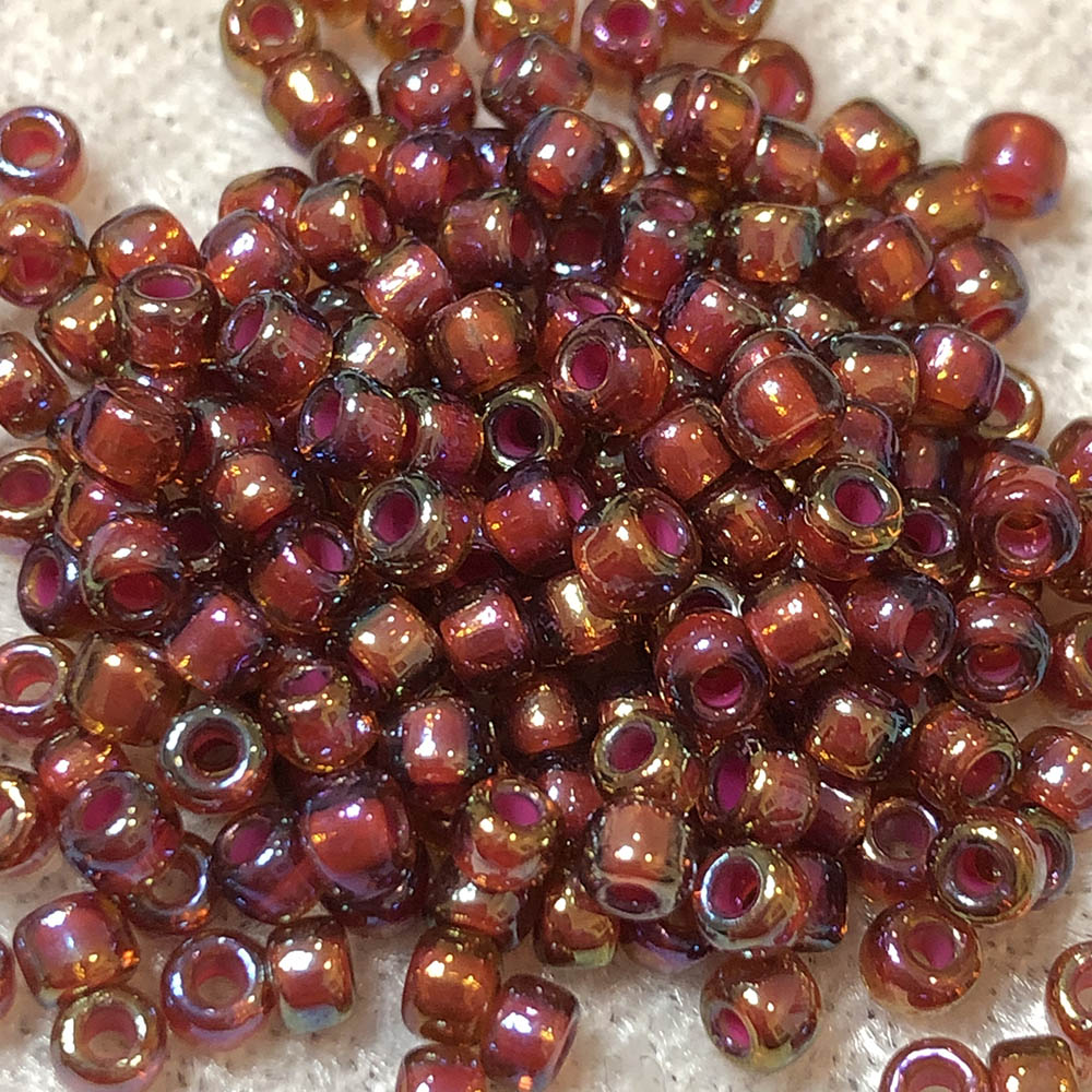 8/0 Colorlined Light Garnet Rainbow 389A Japanese Seed Beads